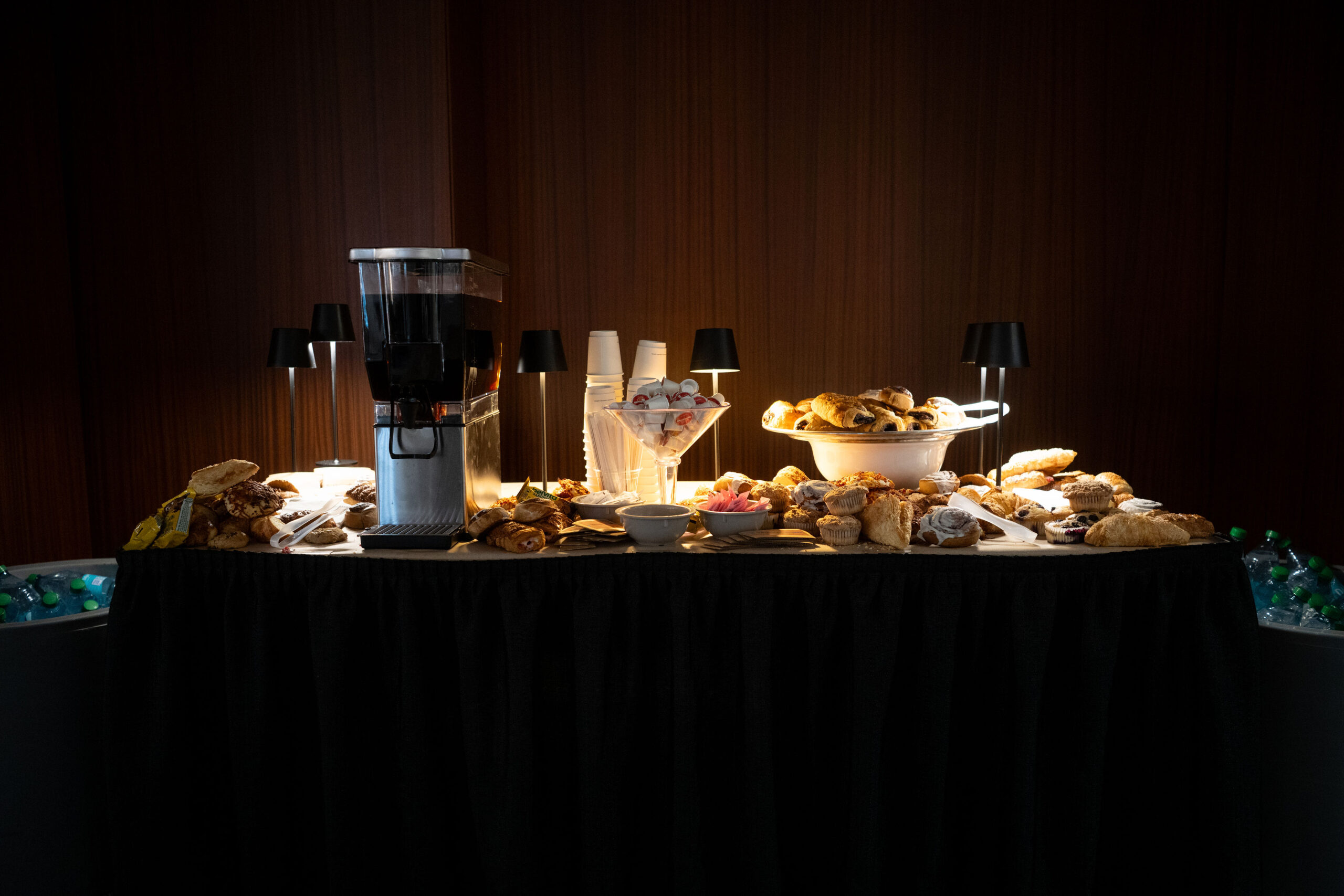 Elegant dessert table with a variety of sweets and a coffee grinder.